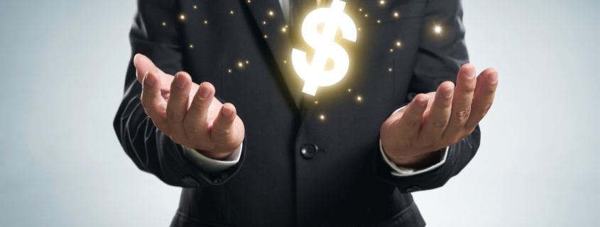 graphicstock businessman holding dollar symbol r jXnwesl