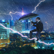 young businessman with umbrella against thunderstorm overcoming challenges and crisis SBI 301985594